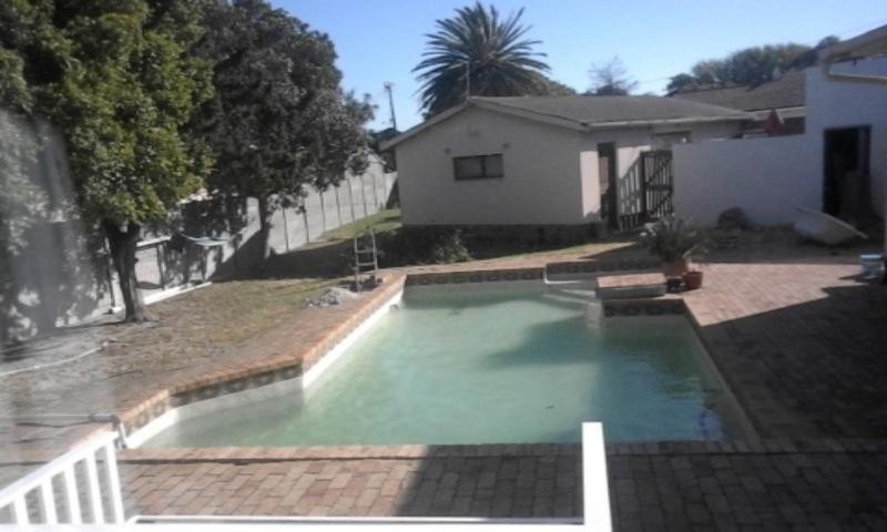 Year-round outdoor swimming pool and garden at the retreat